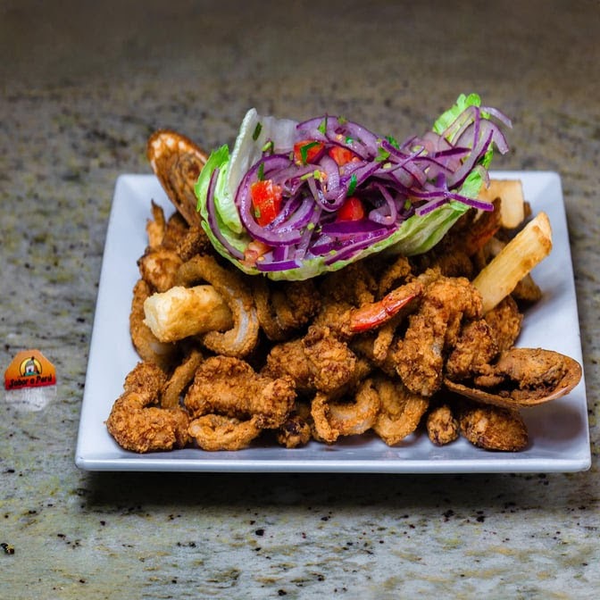 Fried seafood platter with salad